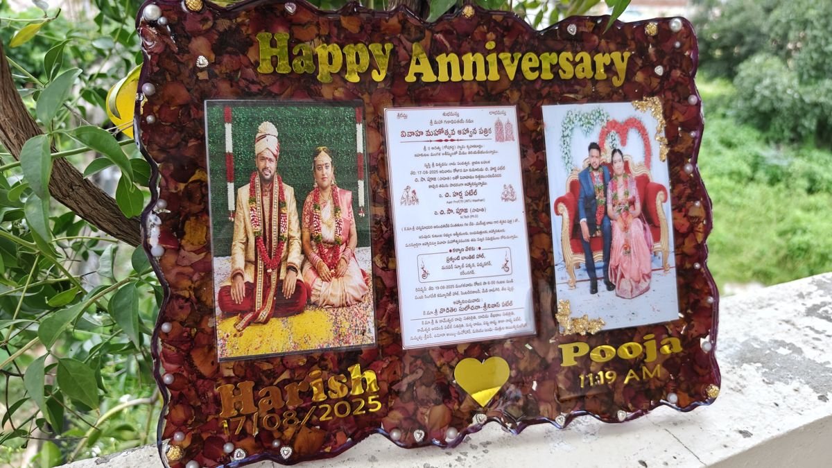 Large anniversary resin frame with wedding photos and invitation