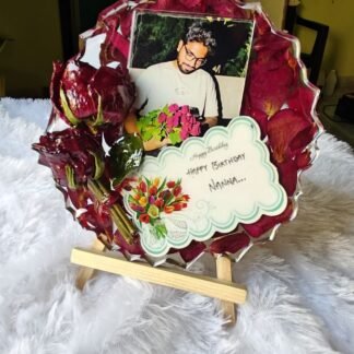 Round resin frame with a photo, preserved roses and a handwritten note