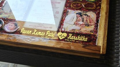 Varamala flowers and wedding photos preserved in a resin frame