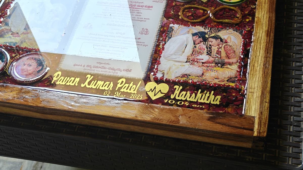 Varamala flowers and wedding photos preserved in a resin frame